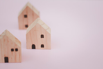 Wall Mural - house wood model concept on blue background and copy space for your text investment insurance and home purchase mortgage real estate concept