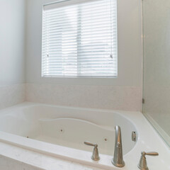 Wall Mural - Square frame Interior of a bathroom with bathtub and white walls with window