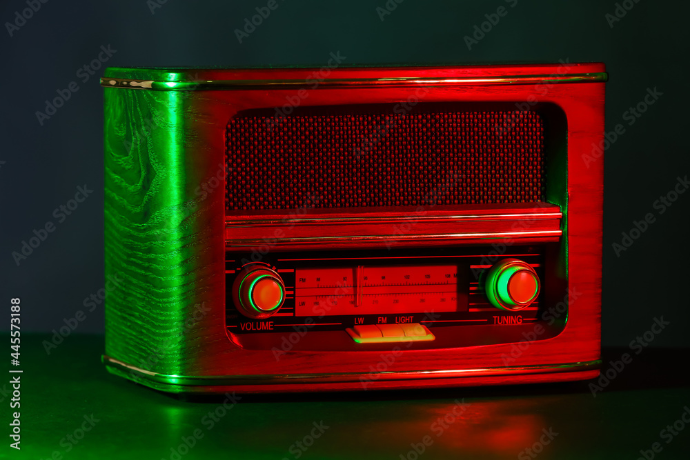 Retro radio receiver on dark color background