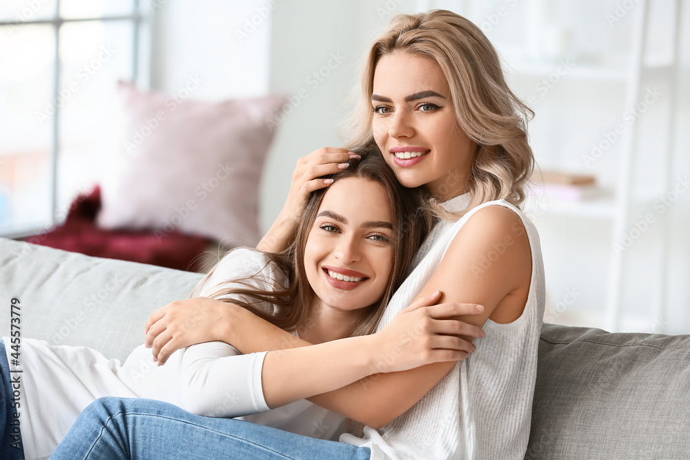 Beautiful young sisters at home