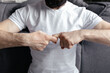 © Kate Chernyshova - A brutal man sitting in meditation with his hands folded in yoga mudras