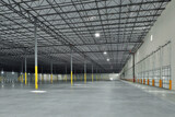 Fototapeta Pomosty - Interior of large empty warehouse industrial storage facility
