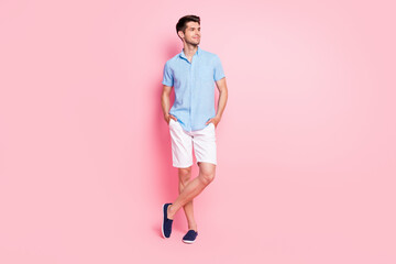 Poster - Full length body size photo smiling man in blue shirt white shorts looking copyspace isolated pastel pink color background