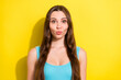 © deagreez - Photo portrait girl with long hair in blue singlet sending air kiss with pouted lips isolated bright yellow color background