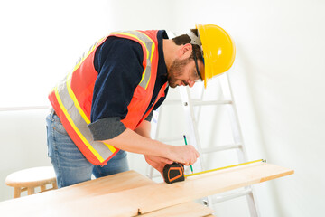 Wall Mural - Working with wood to build a new wall