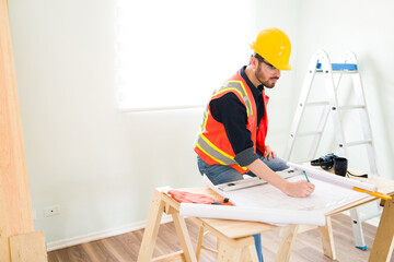 Wall Mural - Contractor working on the construction plans