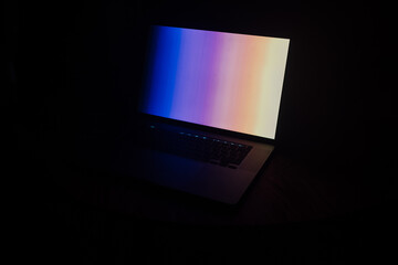 Canvas Print - Closeup shot of a laptop on a dark background