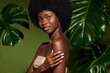 © Beauty Agent Studio - Green and fresh. Beauty portrait of young beautiful african american woman with posing against green exotixc plants  background. Natural skin care concept