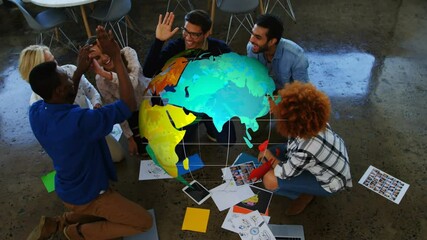 Poster - Animation of rotating globe over happy diverse colleagues celebrating at brainstorm meeting