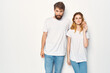 © SHOTPRIME STUDIO - cheerful young couple in white t-shirts embrace friendship lifestyle