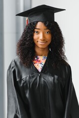 Wall Mural - Excited African American woman at her graduation.