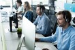 © opolja - Young handsome male customer support phone operator with headset working in call center