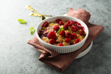 Wall Mural - Traditional homemade raspberry crumble with fresh mint