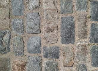 Wall Mural - Texture of gray granite paving stones, top view. Background from natural block stone.