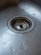 old sink with water droplets in soft blueish light