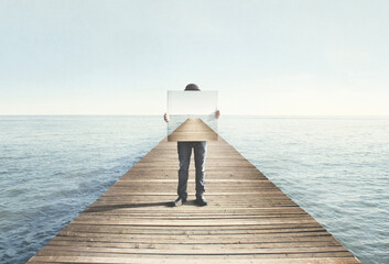 man holding surreal painting of a boardwalk, abstract concept