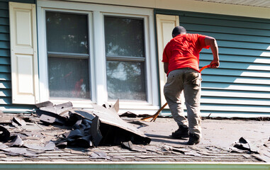 Contracter on removing shingles on a roof