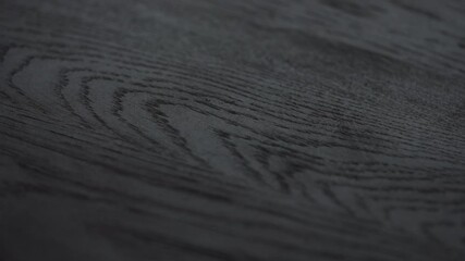 Wall Mural - Slow motion shot of black oak wood surface