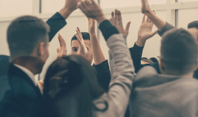 Wall Mural - business team giving each other high five in new office.