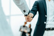 close up. businessman and businesswoman shaking hands with each other