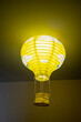 © Tanakit_Ktt - bright yellow balloon shaped paper lanterns,