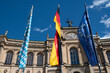 Bavarian, German and European Union flags in front of the Maximilianeum / Bavarian State Parliament building in Munich, Germany