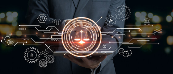 Businessman touching the icon of the balance of justice. Concept of legal advice, law and defense.