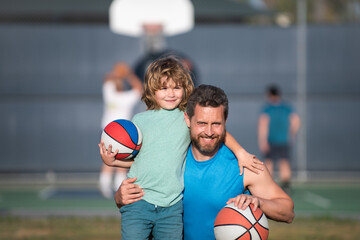 Wall Mural - Dad and his son playing basketball. Father and son enjoying sport basketball outdoor. Childhood and parenting concept.