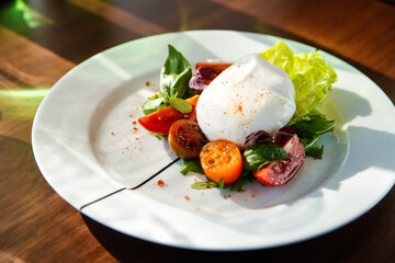 Canvas Print - High angle shot of a salad with whole egg and sliced cherry tomatoes