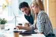 © nenetus - Successful business team working together with digital tablet in coworking place.