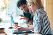 © nenetus - Successful business team working together with digital tablet in coworking place.