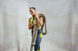 © Jacob Lund - Female athlete with battle rope on white background