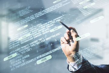 Poster - Male hand with pen working with abstract virtual coding concept on blurred office background. Multiexposure
