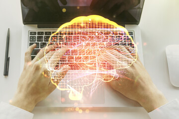 Poster - Creative artificial Intelligence concept with human brain hologram and hands typing on laptop on background. Multiexposure