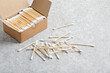Bamboo cotton buds in carton box. Ethical, sustainable, no plastic lifestyle idea. Top view, mockup