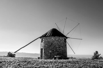 Wall Mural - Black and white landscape of an old windmill