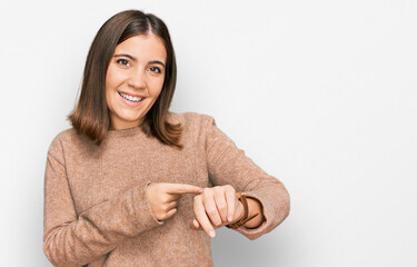 Poster - Young beautiful woman wearing casual clothes in hurry pointing to watch time, impatience, upset and angry for deadline delay