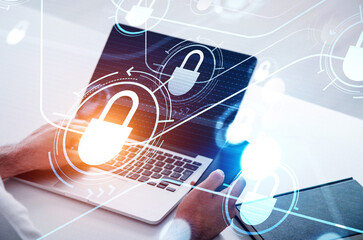 Poster - Hands are typing on laptop keyboard and using smartphone with touch screen, blue and orange glowing information protection padlock icons. Concept of cyber security and data storage