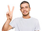 © Krakenimages.com - Hispanic young man wearing casual white t shirt showing and pointing up with fingers number two while smiling confident and happy.