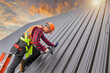 © saravut - Roofer Construction worker install new roof,Roofing tools