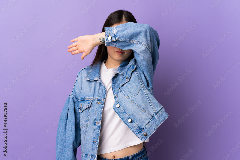 Young Chinese girl over isolated purple background covering eyes by hands - obrazy, fototapety, plakaty 