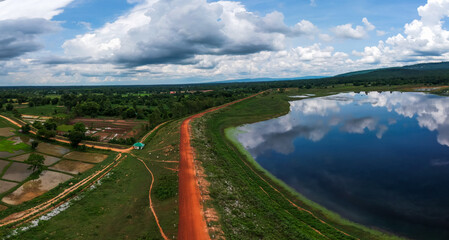 Wall Mural - Aerial photograph of Huai Kloem Reservoir with beautiful roads and mountains in rural Thailand.