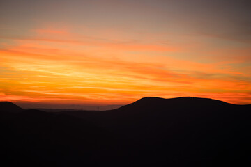 Wall Mural - Colorful sunset over the mountain hills. Beautiful landscape in Azerbaijan nature.