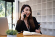 © itchaznong - Agent sales manager vehicle insurance makes contact with her customer. Saving and Insurance concept.