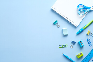 Wall Mural - Flat lay school stationery on blue desk table. Top view, overhead. Back to school concept.