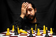 © Narayan - latin man with beard challenging in chess game, chess concept