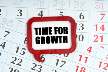 Wall Mural - On the calendar, a red plaque with the words inside - TIME FOR GROWTH