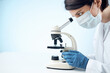 © SHOTPRIME STUDIO - woman laboratory assistant medical mask microscope diagnostics biotechnology