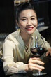 © DragonImages - BEautiful woman spending Saturday night at fancy restaurant and drinking red wine