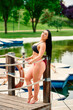 © Carlos - Mujer joven en bikini tomando el sol